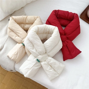Quilted puffer scarves in beige, white, and red with a practical crossover design