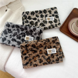 Thick leopard print plush scarves in three colors with woven label on soft fabric