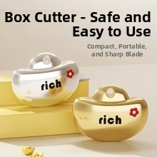 Detail of gold and silver ingot shaped utility knives with sliding buckle mechanism