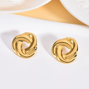 Retro golden stainless steel twisted spiral hoop earrings with irregular texture