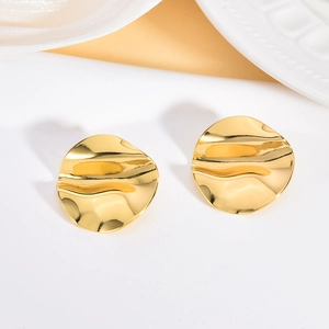 Detailed view of uneven wave texture on irregular 304 stainless steel gold stud earrings