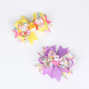 Detailed view of Easter hair bows with cute chick and bunny resin centers for girls