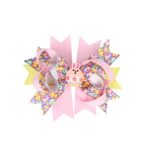 Easter hair bow for girls with colorful egg print ribbons and a cute pink rabbit resin charm