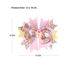 Easter hair bow detail with festive egg prints, cute bunny charm, and product dimensions