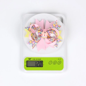 Detailed view of handmade Easter bow hair clip with bunny resin weighing 12.0 grams