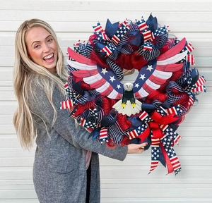 Close-up of American flag wreath with mesh fabric and bald eagle centerpiece for July 4th
