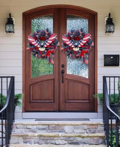 Detail of USA eagle wreaths on a front door for Independence Day patriotic decoration