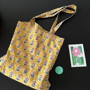 Eco-friendly cotton tote bag with traditional Indian floral print and dual handles