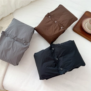 Solid color neck gaiter scarves in brown, gray, and black with button closure details
