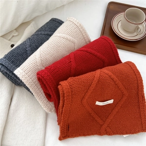 Cross-knit wool scarf for winter in burnt orange, red, beige, and dark grey colors