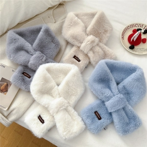 Plush cross-style faux fur scarves in solid pastel colors with leather patch detail