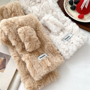 Detail of soft plush scarves in beige and cream white with delicate wavy texture