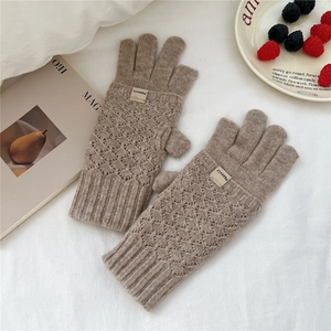 Detailed knit texture of khaki diamond-patterned convertible mittens with brand tag