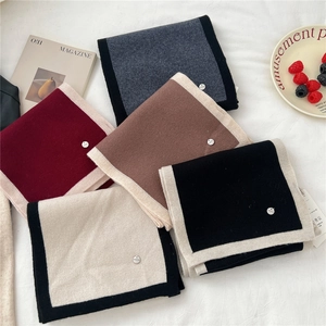Dual-sided knit wool scarf collection in five colors with premium metal tag detail