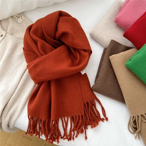Orange solid color knitted wool scarf with fringe tassels for winter warmth and fashion