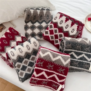 Soft checkered knit scarf in vintage red and grey Nordic patterns for cozy winter style