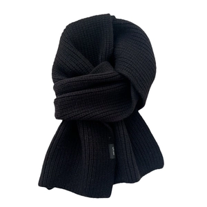 Classic black knitted 100% wool scarf with ribbed texture and minimalist fabric label