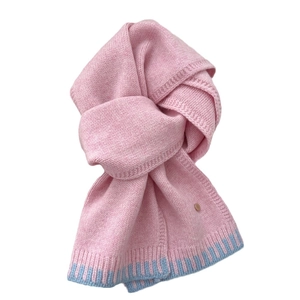 Pink wool knit scarf with light blue ribbed contrast and small gold metal button detail