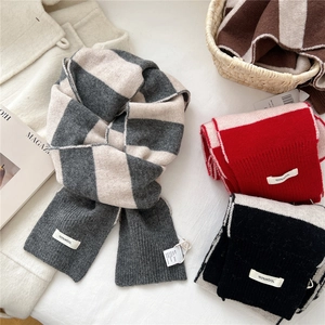 Thick wool knit scarf with horizontal stripes in various colors for winter warmth