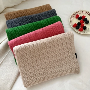 Chunky knit wool scarf with classic cable patterns in multiple autumn colors for winter