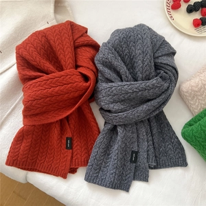 Thick 100% wool knit scarves in orange and dark grey with elegant cable patterns
