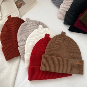 Knitted wool beanie collection with ribbed design and folded cuff for winter warmth