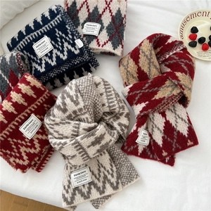Thick geometric knit scarves in multiple colors with cozy argyle and wave patterns