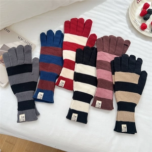 Cozy striped knit gloves in various colors for winter warmth and soft comfort