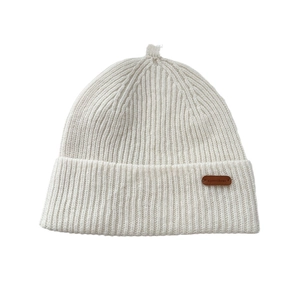 Off-white ribbed knit wool beanie with leather patch and micro-ring detail on top