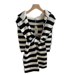 Classic black and white striped knitted shawl with shoulder wrap design and woven label