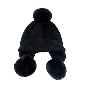 Black knit trapper hat with three faux fur pom-poms and warm cable stitch pattern