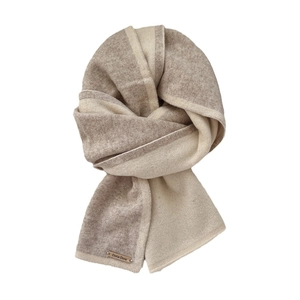Knitted two-tone wool scarf in beige and brown with metal brand tag on white background