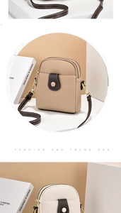 Détail du sac à bandoulière pour téléphone en cuir grainé avec double fermeture éclair