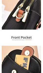 Detail of lychee pattern leather texture with golden zippers and magnetic pocket