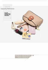 Internal storage view of beige crossbody bag with cosmetics and phone capacity details