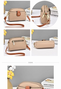 Detail view of beige lychee leather crossbody bag with dual zippers and contrast brown flap