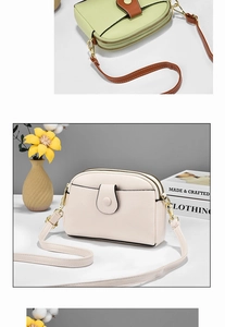 Detail of lychee textured mini crossbody bag with double zippers and ivory green colors
