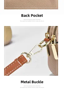 Detail of brown litchi leather bag showing back pocket and gold hardware clasps