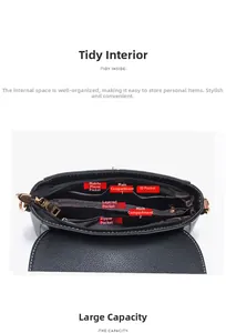 Internal structure of black leather crossbody bag featuring multiple storage compartments