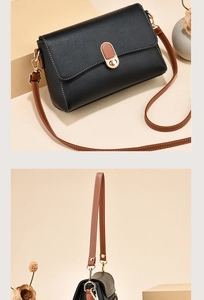 Detail of black litchi texture shoulder bag with brown strap and oval metal twist lock