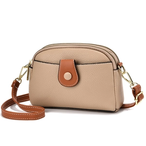Chic beige lychee leather crossbody bag with brown straps and three zipper layers
