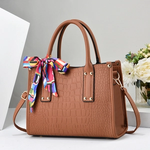 Elegant brown crocodile embossed tote bag with printed silk scarf and adjustable strap