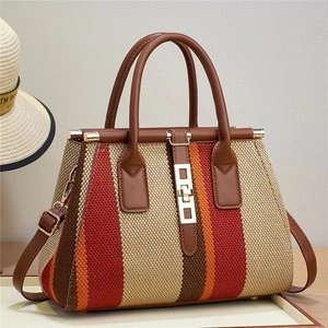 Retro multi-color vertical striped woven tote bag with brown leather handles and lock