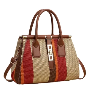 Large capacity striped woven handbag with leather handles and gold hardware details
