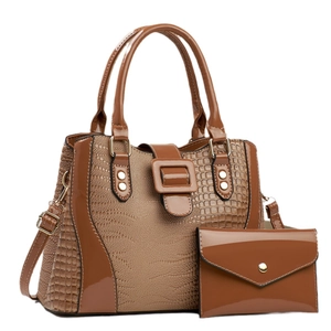 Brown faux leather handbag and matching clutch with glossy finish and crocodile texture