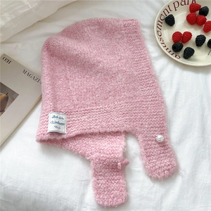 Pink knit hooded scarf with pearl accent and logo patch on white fabric background