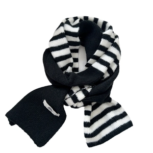 Classic black and white striped knitted scarf with soft yarn and logo patch detail