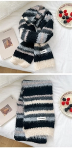 Close-up of thick multi-color striped knit scarf with soft fluffy texture and brand label