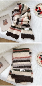 Macro detail of multi-color striped knitted scarf texture with brand label and mohair feel