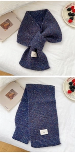 Close-up of blue-purple knit scarf with soft texture and chic ins brand label
